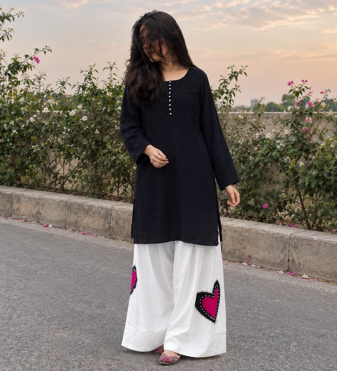 Woman wearing a Black white dress with heart shape